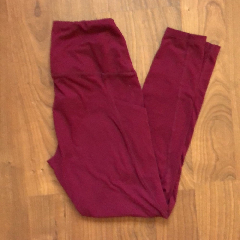 High-waisted maroon athletic leggings
